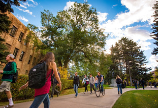 UW students walk on the University of Wyoming campus between classes.