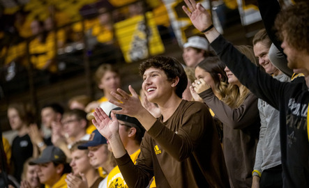 A UW student cheers during a University of Wyoming basketball game.