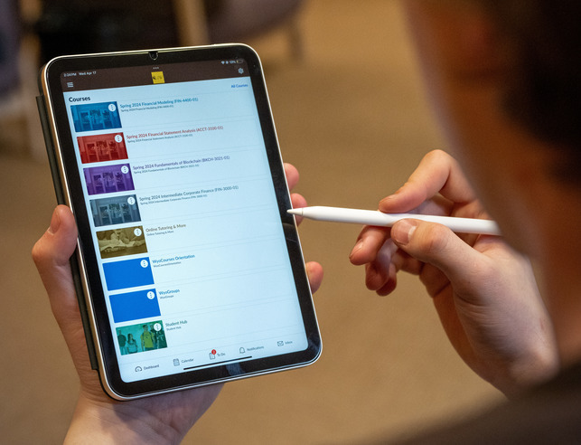 Person holding ipad with options