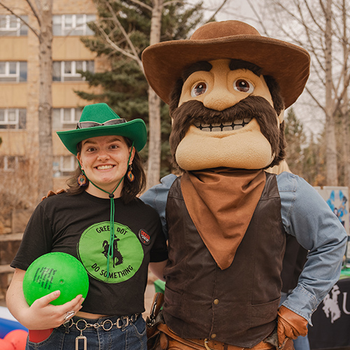 A Green Dot coordinator poses with Pistol Pete.