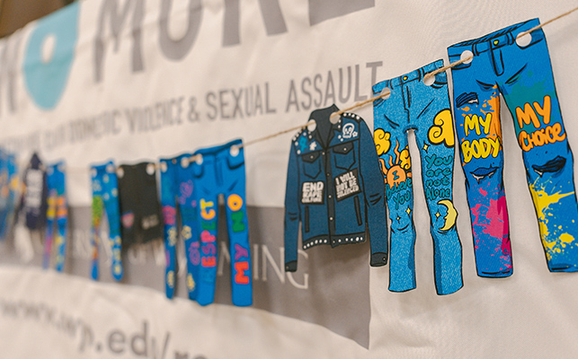 A series of paper cut outs that look like jeans. Text reads "My body, my choice." and "You are not alone."