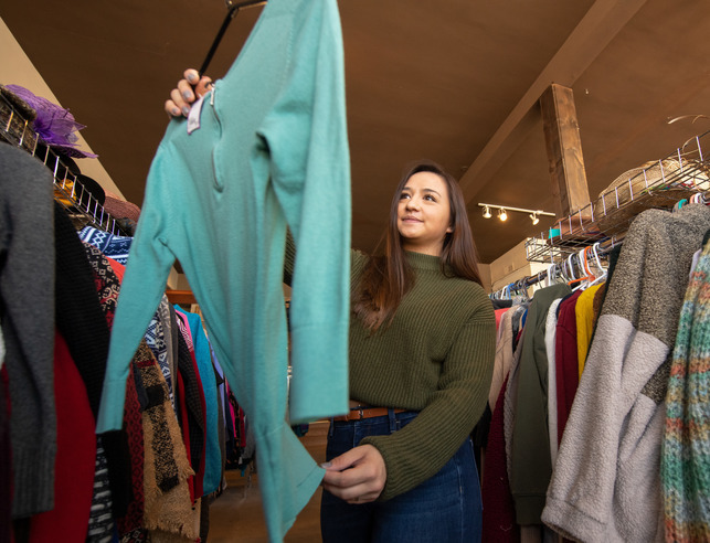Female looking at a sweater