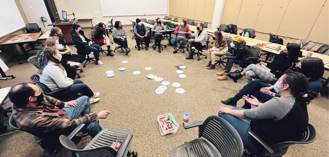 Restorative Justice participants sitting in a circle for an activity.