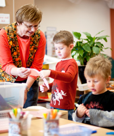 Preschool children working with teacher