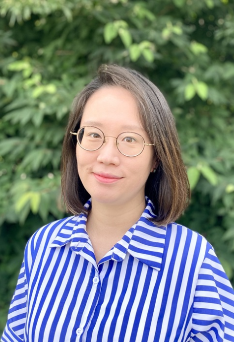 Dr. Min Jung Lee in a blue and white striped blouse