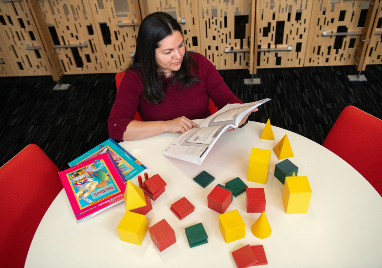 Teacher reading a book