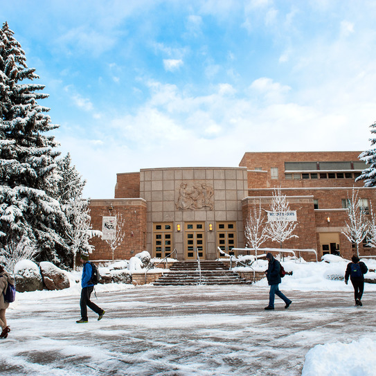 Students walking by the College of Education