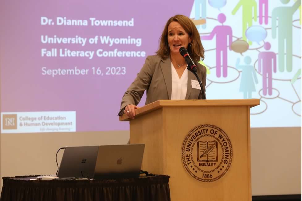 A woman speaking at a conference