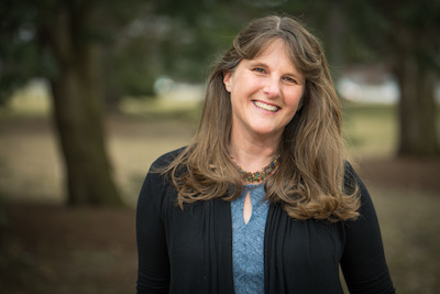 A woman smiling at the camera
