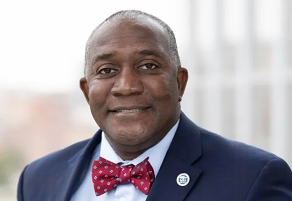 a man smiling at the camera