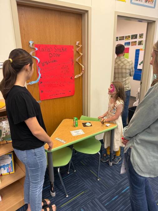 a student presenting a poster
