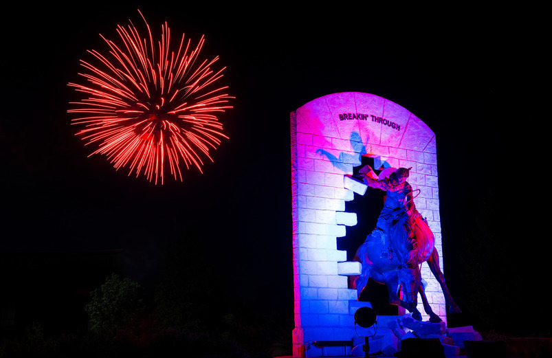 Fireworks behind UW's Breakin' Through statue