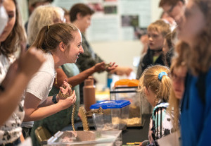 College student helping younger students