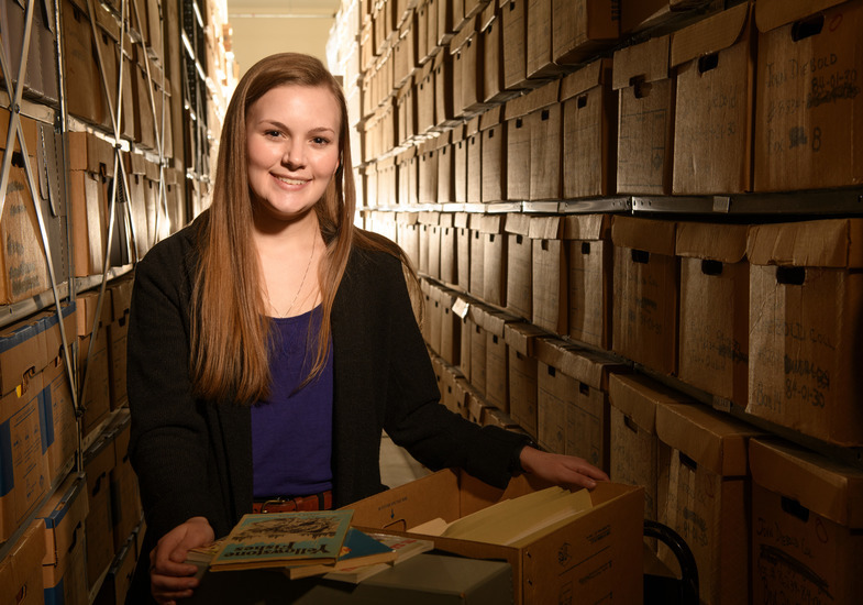 Graduate student uses archives for research.