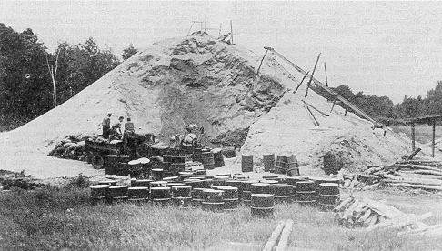Figure 371 - Sawdust being incorporated into grasshopper bait, 1938 