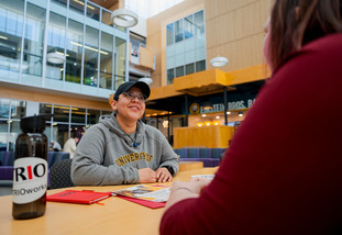 A UW student and faculty member meet for an advising meeting.