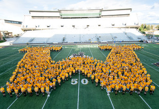 freshmen class form W with their bodies in the War Memorial Football Stadium