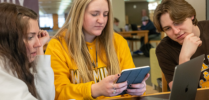 students studying together in the library