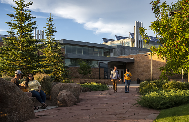 family and consumer sciences masters students in the graduate program in nutrition and dietetics outside a building on the university of wyoming campus