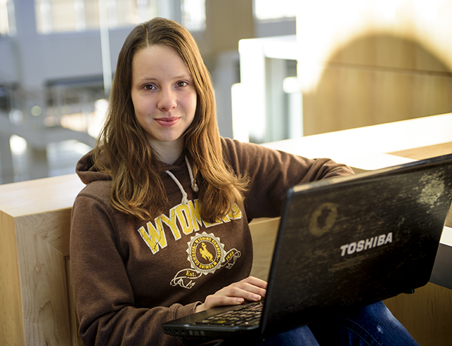 a family and consumer sciences student with her laptop