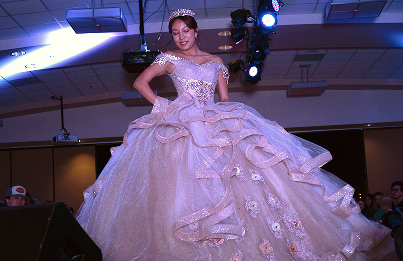 a beautiful ball gown worn by a model in the kaleidoscope fashion show in family and consumer sciences' design merchandising and textiles program