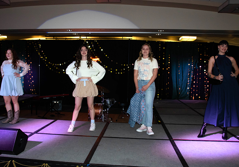 a row of models from our kaleidoscope fashion show event planning class