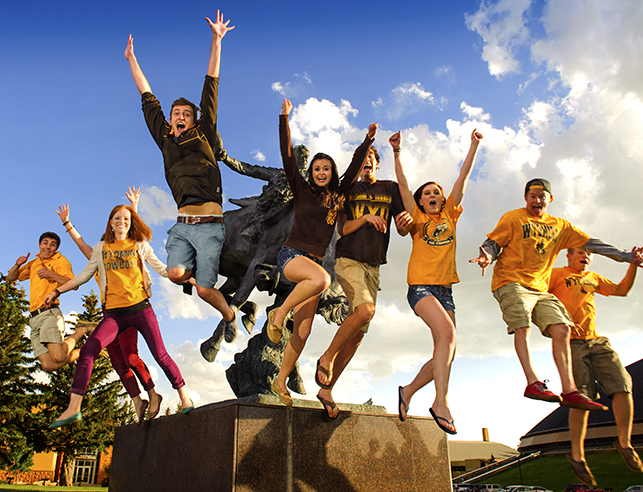 several family and consumer sciences majors jumping for joy for winning scholarships from FCS