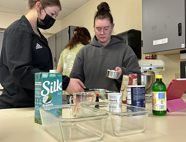 students in the human nutrition and food undergraduate program take hands-on lessons cooking in our family and consumer sciences teaching kitchen