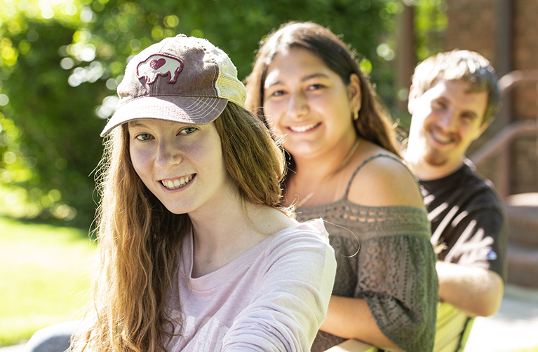 three family and consumer sciences students looking back towards the camera