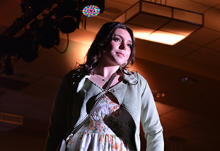 a model on the runway during the kaleidoscope fashion show presented by the department of family and consumer sciences