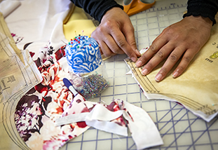 a family and consumer science student drafting a sewing pattern