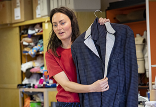 a lecturer in family and consumer sciences demonstrating apparel merchandising