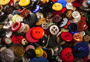 a collection of apparel buttons representing the design merchandising and textiles program in family and consumer sciences