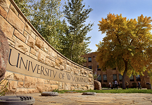 stone sign in front of the student union that reads university of wyoming