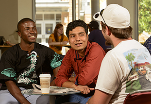 three family and consumer sciences graduate students discussing their latest FCS research opportunities