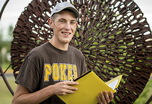 a family and consumer sciences student with a textbook
