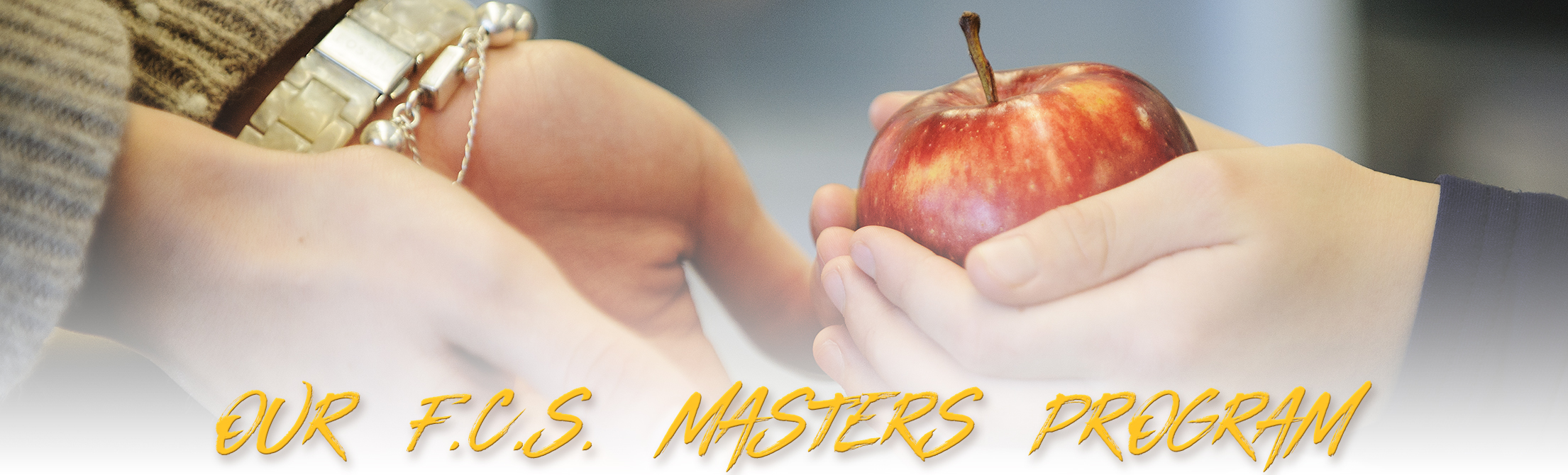 a child handing an apple to one of our faculty in the Department of Family and Consumer Sciences masters program with text that says "our FCS masters program"