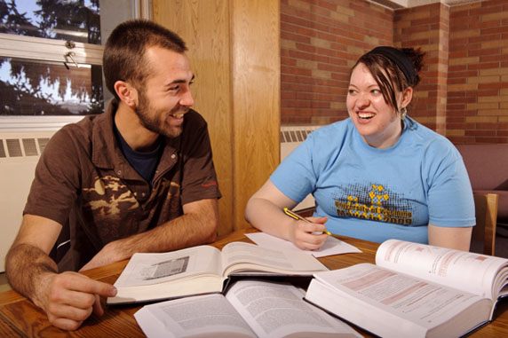two students study together in the fishbowl of the UW residence halls
