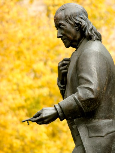 Statue of Benjamin Franklin holding a key