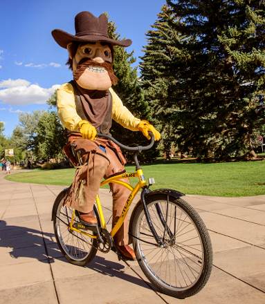 Pistol Pete riding a bicycle