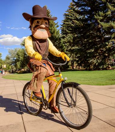 pistol Pete riding a bike