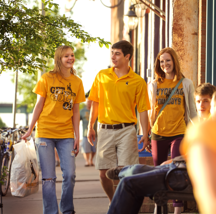 three students walking in downtown Laramie