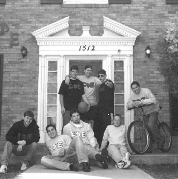 men of Sig Ep outside of their house 