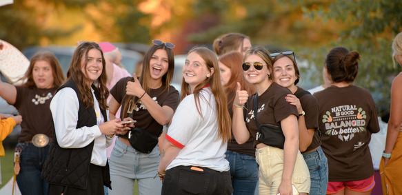 A group of UW sorority members smile at the camera during a fraternity and sorority event