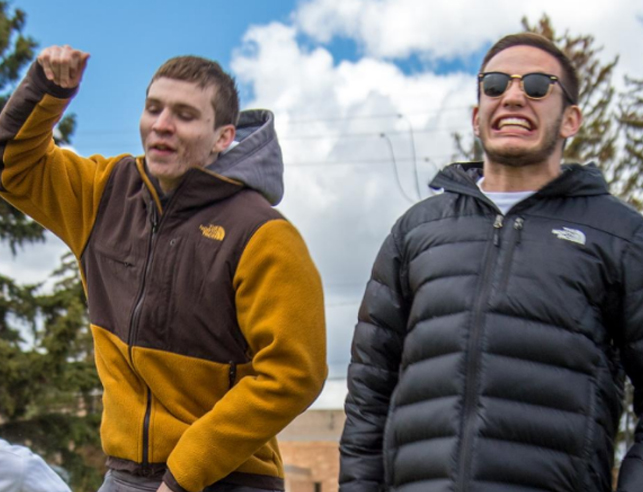 Two students smiling outside