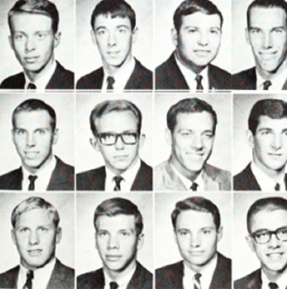 Men in black suits and ties sitting for their composite photo