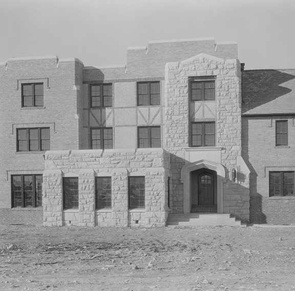 The first sorority house on the row, built to look like the other buildings on campus with lots of windows and rock work