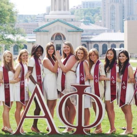 Members of Alpha Phi with graduations stoles on.