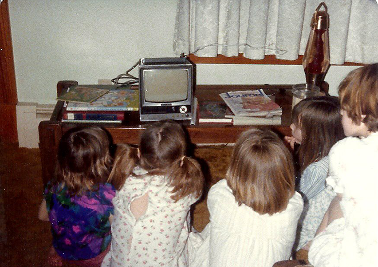 1979 picture of Five children sitting around a very small televesion set