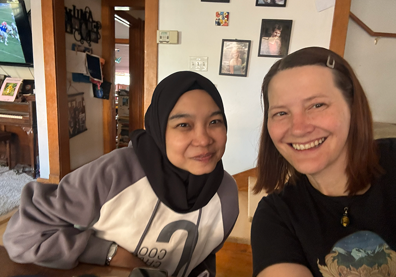 Suci and Mollie pose in Mollie's home